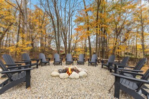 Fire pit area with twelve Adirondack chairs