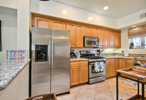 The open, airy kitchen offers ample space & every home comfort