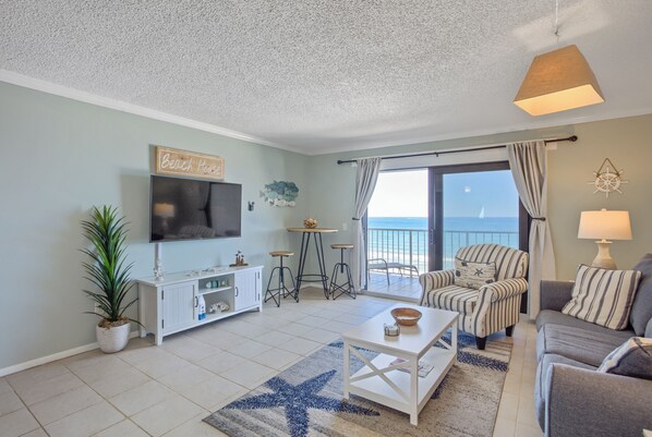 Cozy and spacious living area with TV