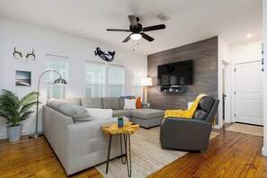 Relax and indulge in your favorite shows on the lush sofa