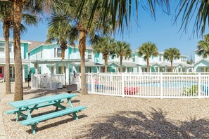 Lounge & dine in the fresh air in the poolside communal BBQ area