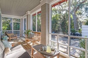 Enjoy cozying up in the sunshine on the screened in porch.