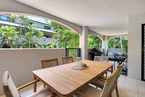 Enjoy outdoor dining or simply relax on the private balcony, complete with a BBQ grill and views of tropical greenery.
