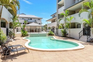 Cool off in the complex’s shared pool, surrounded by lush landscaping—perfect for a refreshing dip on warm days.
