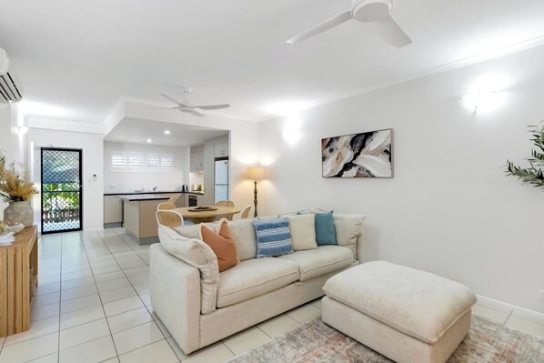 Unwind in the open-plan living and dining area, designed for comfort with plenty of space to relax and dine.
