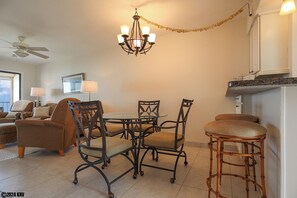 Dining Area has glass topped table for 4