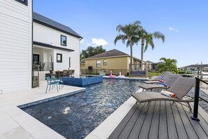 The sparkling, well-maintained pool invites you to cool off during the day or unwind by the water as the sun sets.