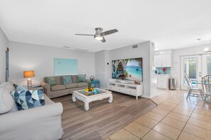 The soothing color palette and beach-themed décor immediately create a calm and welcoming atmosphere.