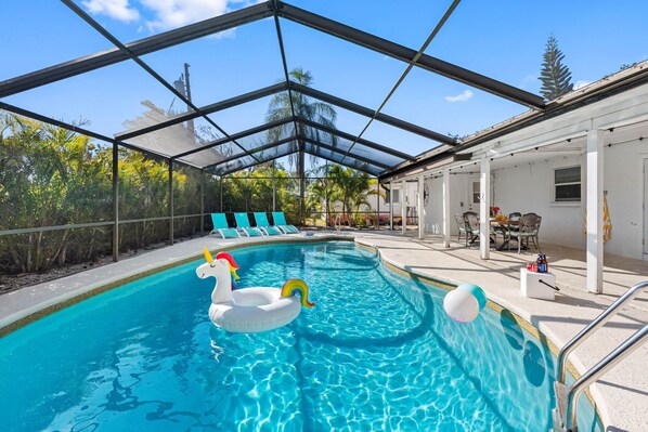 Designed to blend relaxation and style, this inviting outdoor space offers a heated swimming pool.