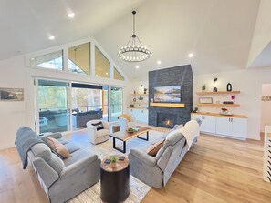 16’ sliding glass door seamlessly connects indoor and outdoor living.