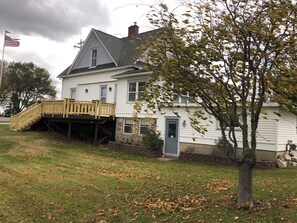 Exterior showing large deck with new handrails.