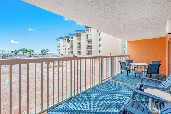 Spacious balcony with view of the pool and gulf