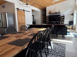 Modern open concept area. Extra seating at kitchen island and side counter table