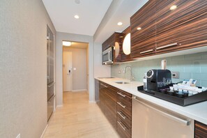 Sleek kitchenette with coffee amenities.