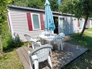 Plant, Furniture, Window, Blue, Tree, Outdoor Furniture, Shade, Chair, Grass, Table
