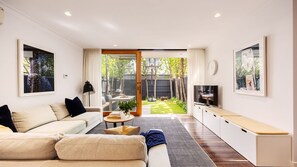 Light and Bright open plan living room with smart TV