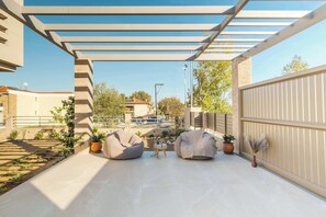 Breathe in tranquility in the serene shared garden area.