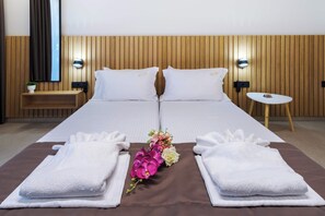 Soft sheets, warm lighting – your perfect retreat after a day in the sun.