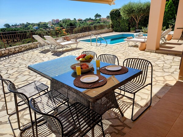 covered outside dining leading out from kitchen 