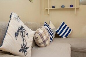Occasional cushions on the fabric sofa