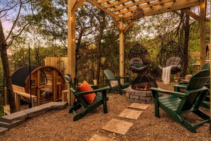 Cozy up around the firepit under the pergola, perfect for storytelling, s'mores, and starry nights.