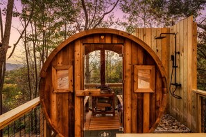 Step inside your private Scandanavian-style barrel Sauna for a warm, soothing escape overlooking the great outdoors. It has an outdoor shower for ultimate relaxation.