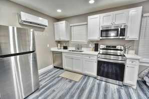 Cook with ease in this modern, well-stocked kitchen.
