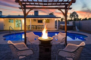 Gather around the firepit for cozy nights by the pool, where relaxation meets serenity.
