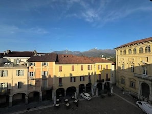 View of Piazza della Cisterna and The Alps from Living Room