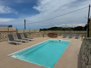 With a private pool and stunning sea views