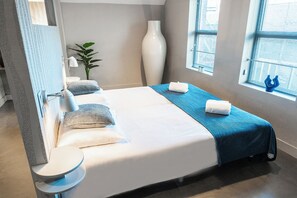 A cozy, well-lit room offering all the essentials for a comfortable stay. Ideal for solo travelers or couples looking for a relaxed, personalized experience.