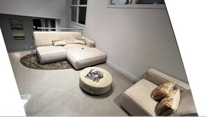 A communal (shared) space at the entrance of the building, before entering the hallway with the private suite and private bathroom. It’s ideal for unwinding after a long day or enjoying a good book in a serene setting.