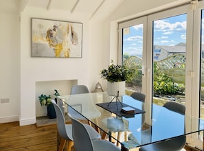 Feel refreshed as the sunlight floods into this delightful dining area. Look out across the fields. If you're working, you've got plenty of space for your laptop and notes to keep on top of your in-box whilst away