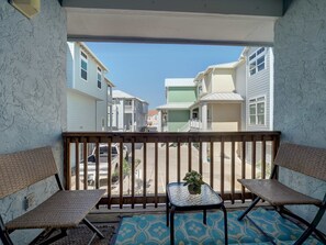 Unwind on the balcony with two cozy chairs and a center table—perfect for morning coffee or evening conversations.