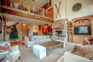Wood burning fireplace and smart TV in the living room