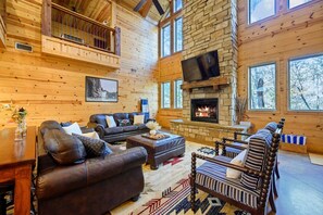 Open concept living/dining/kitchen. 65" smart TV (BYO Login). Gas fireplace