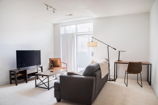 Spacious living room with private balcony