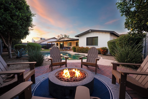 Enjoy a drink by the fire pit as you watch the sunset.