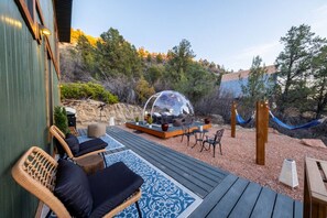 Relax on the deck as the sun sets, in the hammocks, and by the tiny fire pit (solostove).