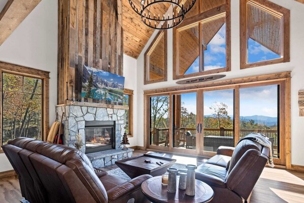 Wall of Windows in the Living Room Looking Over Mountain Views