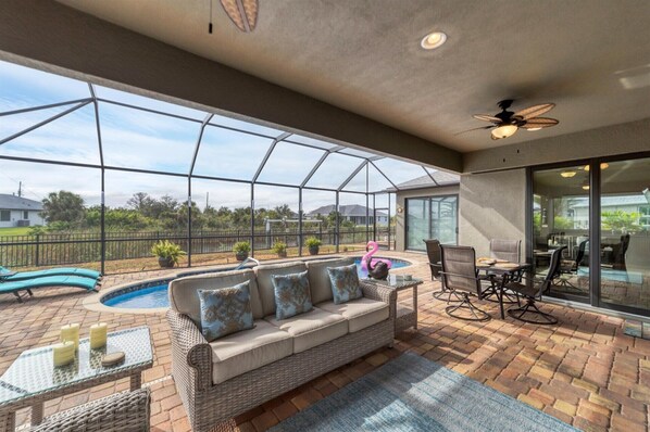 Perfect outdoor space overlooking the pool and canal.