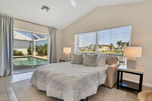 Wet bar &amp; additonal sleeping space overlooks the canal &amp; features a wet bar, lanai access and a queen sleeper sofa