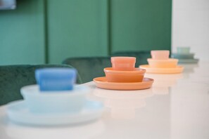 We've got you covered! Kid-friendly dinnerware and a highchair are ready for your little ones, making mealtime stress-free for families!