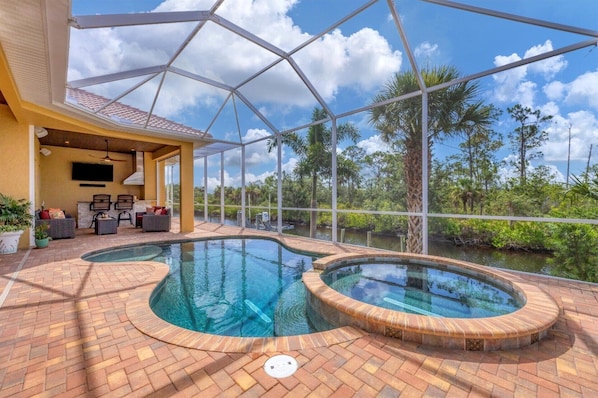 Sparkling saltwater pool & spa overlooking water. Pool size is 17'L x 10'W x 6'D