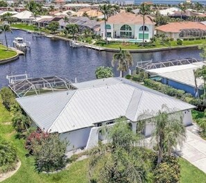 HOME HAS OUTSTANDING WATER VIEWS AT INTERSECTION OF TWO CANALS