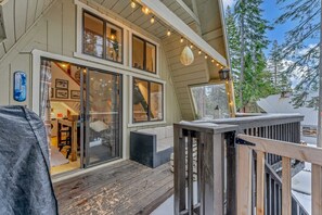 Exterior: Private deck, outdoor seating gas BBQ, bistro lighting 
