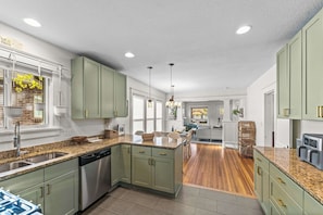 The kitchen features stainless steel appliances