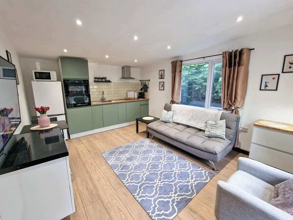 Kick back and relax in our comfy living room, ideal for movie nights or catching up with friends.