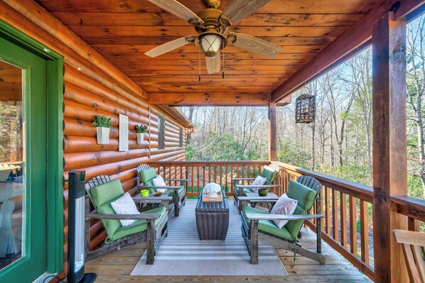 Savor the crisp breeze on the porch with comfortable outdoor seating