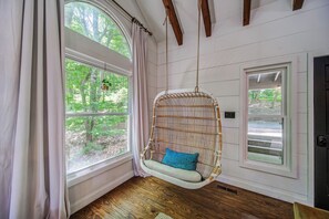 Curl up with a book and sway in the sunshine in the living room